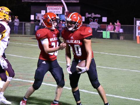 Andrews' Jose Martinez celebrates an interception with teammate Cade Vaughn during Friday's win over Cherokee.
