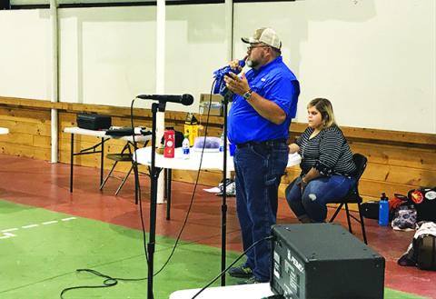 Auctioneer Greg “Pork Chop” Huskins helped keep the money flowing from attendees