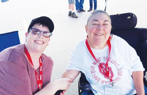 Shelly Stephens (right) and Diane Bishop helped out at this year’s Toys for Tots poker run, as they do at many community events in Cherokee County.