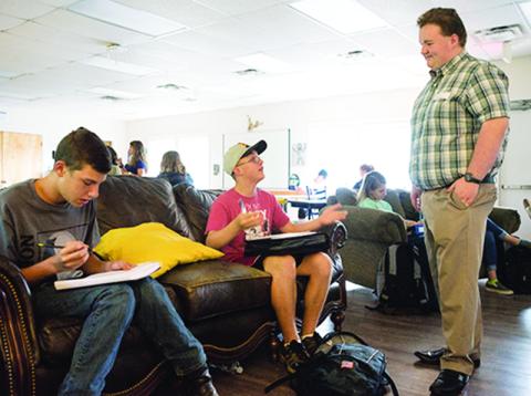 Jacob Odell and Isaac Jensen get some sage advice from recent Tri-County Early College graduate River Collins on the first day of school.