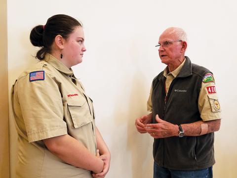 Dave Hotchkiss, charter organization representative for Scouting in Murphy, advises Troop 4400 Scout Cheyenne Griffith during Monday’s veterans tribute at Peachtree Memorial Baptist Church. Photo by Samantha Sinclair/scoutingaround@cherokeescout.com