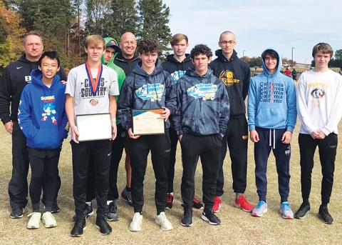 The Murphy boys cross-country team poses after their third-place performance at the state meet. Team members are (front row, from left) Richard Ly, Caleb Jones, Chase Pierce, Andrew Bryson; Back row are (from left) coach Davis Bryant, Clayton Laney, coach Frank Hill, Christian Tighe, Michael White, Caleb Rice and Tanner Roberts. Photo courtesy of Murphy High School