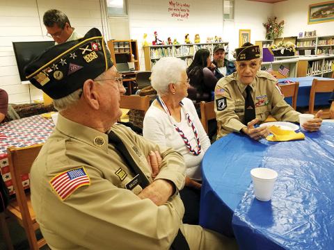 J.C. and Mary McCoy chat with Oscar Valdez (right) during the veterans breakfast provided by Martins Creek School on Tuesday morning.