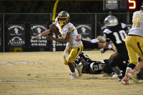 Murphy running back Devonte Murray attempt to evade a swarming Robbinsville defense. 