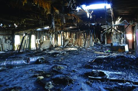 Vagrants used charcoal and paper to create makeshift burn stations throughout the former Hillbilly Mall, which may have started a fire in the building off U.S. 19/74 in Andrews. Photo by Penny Ray