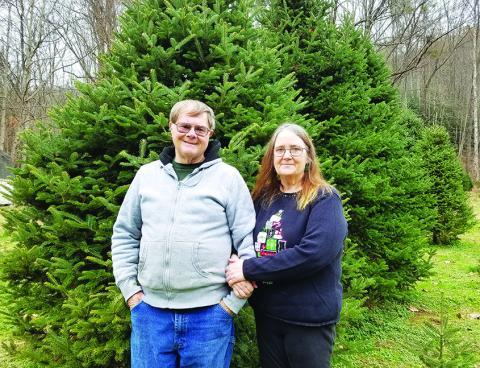 Rick and Judi Postell love welcoming families to their farm and helping them pick out the perfect Christmas tree. Photo by Samantha Sinclair
