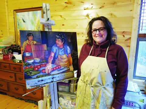 In her home studio, Cynthia Pollett shows "Tomato Cooks," one of her paintings of daily life in China. Photo by Samantha Sinclair