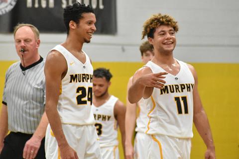 Isra Smith and Abram Abling share a laugh during a break in action against Highlands. 