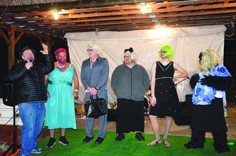 Andrews Mayor James Reid, Andrews Alderman Jonathan Ellison and Tim Radford from WKRK competed in the womanless beauty pageant, which was won by 20-year-old Paris Annas (wearing the green/yellow wig). Photo by Penny Ray 