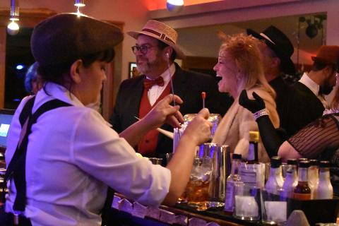 Greg and Beth Fidler of Warne enjoy celebrating at The Crown Brasstown as Andrea Garmon mixes drinks. Photo by Samantha Sinclair