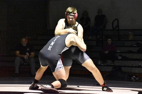 Andrews' Nick Graham puts Robbinsville's Kyle Fink in a head lock. Photo by Kevin Hensley.