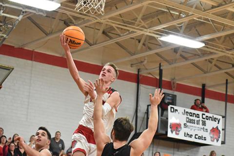 Andrews' Tucker Holloway glides to the rim uncontested. Photo by Noah Shatzer