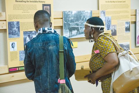 Educators from Botswana - Ipatleleng M. Ntsayakgosi and Ookeditse Johannes - viewed the “When All God’s Children Get Together” exhibit when it first visited the Murphy Art Center in 2017. File photo
