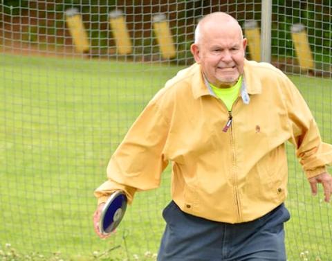 Jim Paul lines up his discus throw during the 2014 Cherokee County Senior Games.