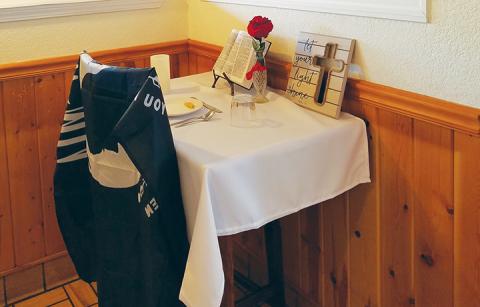 The Missing Man Table at Grandpa Charlie’s County Cookin’ in Andrews is fully decorated to honor those it represents. Photo by Samantha Sinclair