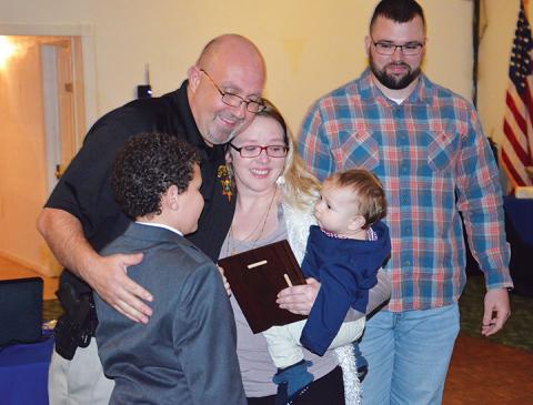 Nichole Wood accepts an award for her fiancé, Joseph Barfield, who passed away last year.  Photo by Penny Ray