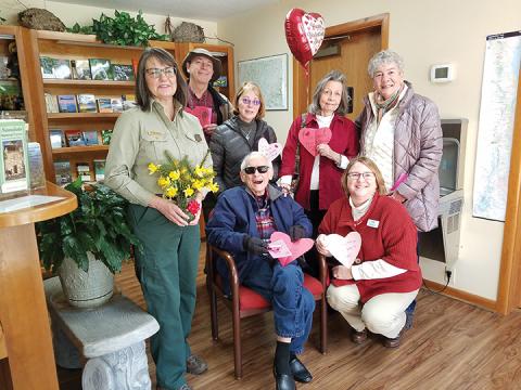 On behalf of the U.S. Forest Service, public affairs officer Cathy Dowd accepted valentines from Frank Landis, Mary Lightner, Lorraine Bennett, Mary Jo Dent, (seated), Tom Bennett and Callie Moore. Photo by Samantha Sinclair