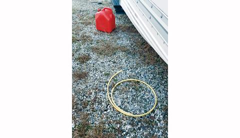 Gas thieves left behind this gas can and siphon hose following a heist at the U-Haul dealership in Andrews.