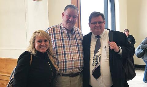 Daniel Hughes (center) and his defense attorneys, Holly Christy and Rich Cassady, following the “not guilty” verdict Thursday at the Cherokee County Courthouse. Photo by Penny Ray