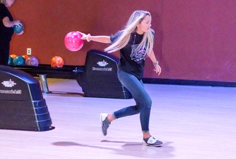 Local residents who were bowling to help Big Brothers Big Sisters of Cherokee County really got into the games Saturday. Photo by Sam Jokich