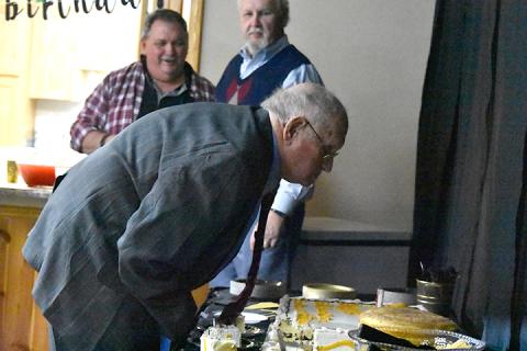 Fred Lunsford blows out the candles on his birthday cake at the party for him Saturday afternoon at Vengeance Creek Baptist Church. Photo by Samantha Sinclair
