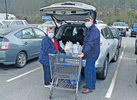 Richard and Mildred Pullium are taking precautions, but like most people still needed to go shopping Thursday. Photo by Sam Jokich