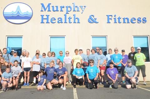 Staff from Murphy Health & Fitness, along with citizens from the community, pose before a 5K run to benefit foster children in May 2019. Photo by Penny Ray