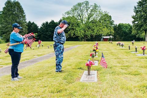 J.D. Baker salutes the fallen. Photo by Sam Jokich