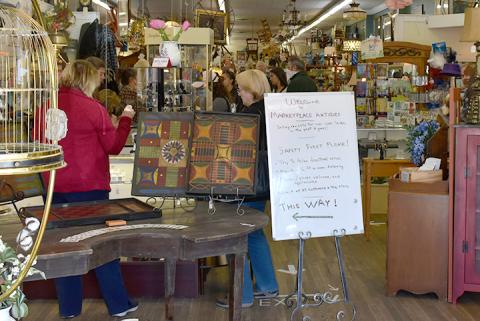 Shoppers followed directions for social distancing as they shopped at Marketplace Antiques on Saturday, the first full day non-essential businesses could open in the state. Photo by Noah Shatzer