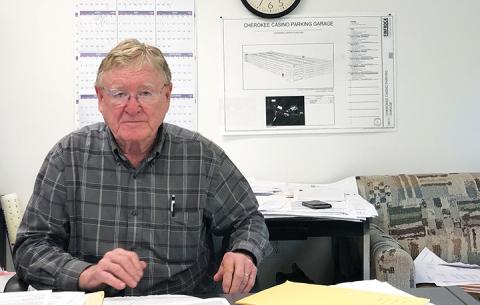 John Glenn works at his office in Topton. He said he has spent “hundreds of thousands of dollars” trying to build an adult care living facility in Peachtree. Photo by Penny Ray