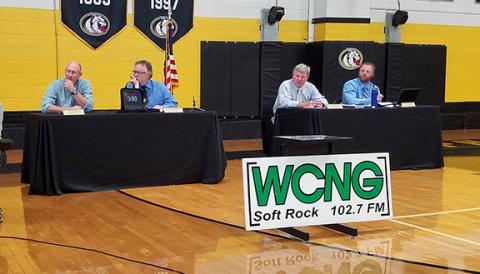 Cherokee County Board of Education members Joey Shore, Arnold Mathews, Dr. Jeff Martin and Chairman Jeff Martin (from left) listen to a comment from a call during the May 20 public hearing at Murphy High School. Photo by Samantha Sinclair