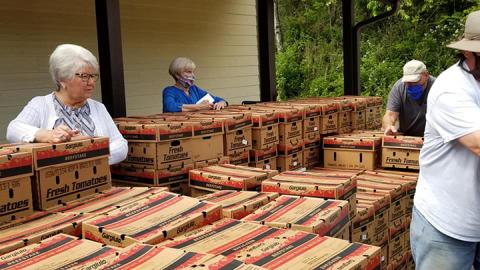 Produce boxes are lined up at the Unaka Community Center on May 21 to be distributed by local volunteers.