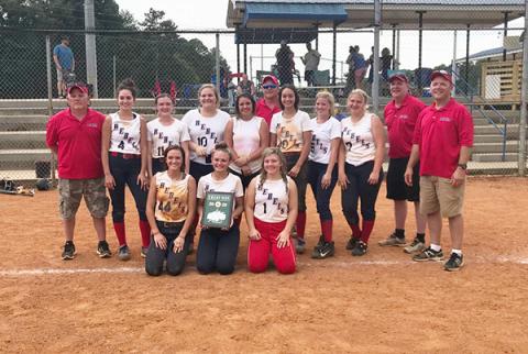 Shown, following the victory, are (from left, front) Riley Smith (Copper Basin), Payton Palmer (Hiwassee Dam) and Kaitlyn Goode (Copper Basin); (middle) coach David Goode, Rylie Payne (Hiwassee Dam), Lauren Brooks (Hiwassee Dam), Allison Stiles (Hiwassee Dam), Karlie Curtis (Andrews), Sydney Payne (Hiwassee Dam), Ansleigh Hogsed (Murphy), Riley Dockery (Murphy), head coach Mark Brooks and coach Shannon Palmer; and (back) coach Dwayne Stiles. 