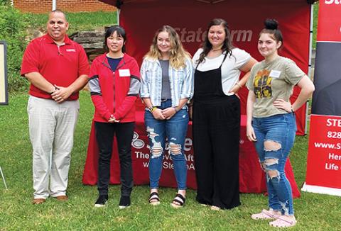 Steven Aft (far left) handed out the annual Extra Mile awards on June 17 at his State Farm Insurance office in Murphy. The Class of 2020 winners include (from left) Ayana Yan of Robbinsville, Isabella Rogers of Hayesville, Journie Newton of Murphy and Victoria Diaz of Andrews. Gracie Ledford of Hiwassee Dam arrived as the event was concluding. Photo by David Brown