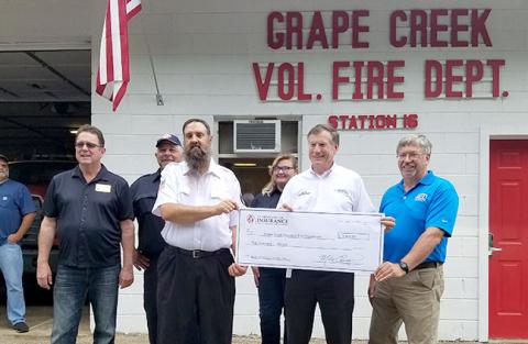 From left are state Rep. Kevin Corbin, Alan Andrews, Grape Creek Fire Chief Joe Lanphere, Rachel Lay, Commissioner Mike Causey and N.C. Firefighter Association financial director Dean Coward. Photo by Samantha Sinclair