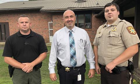 From left are Andrews police Officer Joseph Jones, Cherokee County Sheriff Derrick Palmer and Deputy Patrol Officer Coyle Olsen.