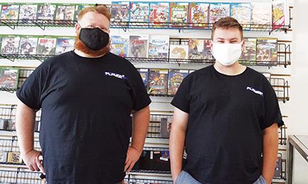 Local residents Dylan Winders (right) and Jonny Moore (left) have been collecting retro video games for years. They recently decided to open a retro game store dubbed Player 2 Gaming in Ranger. Photo by Noah Shatzer