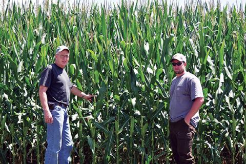 Ed Wood (left) and his son, Matthew, take care of the family farm in Andrews. Ed’s brother, Keith, owns the farm with him. Matthew, who started working at the farm when he was 13 years old, is the fourth generation to work the land. Photos by Samantha Sinclair