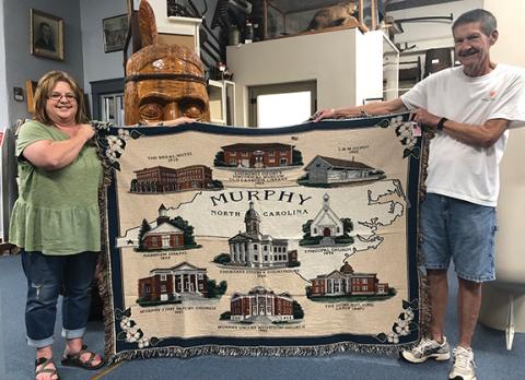 Penny Ray/pennyray@cherokeescout.com Terrisa Carringer and Billy Ray Palmer hold a historical afghan that will be available for purchase from the Cherokee County Historical Museum later this year. 