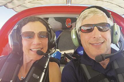 Anne Daley and Adam Molny flying in one of their planes. Daley purchased land more than 20 years ago that she recently donated to Cherokee County and will be sold through a sealed bid process.