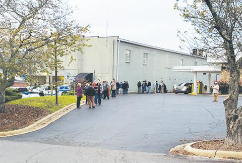 As early voting began Thursday morning, the line to vote wrapped along the side of the Cherokee County Courthouse Annex in downtown Murphy and along the edge of the parking lot for PNC Bank next door. Photo by Samantha Sinclair