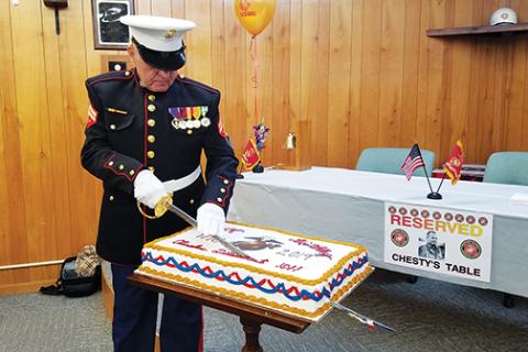 Samantha Sinclair/scoutingaround@cherokeescout.com Bob Lewis, junior vice commandant of the Marine Corps League, Cherokee Detachment 1011, cuts the birthday cake during last year’s birthday celebration.