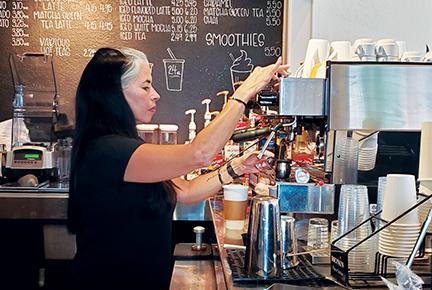 Wendy Megyese, owner of Muttigans in Murphy, prepares a drink for a customer. Photo by Samantha Sinclair