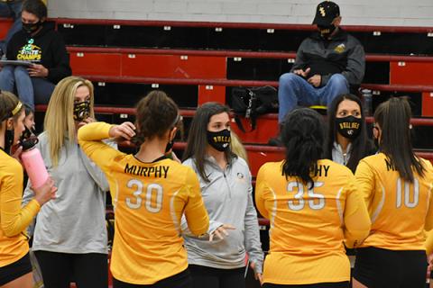 Murphy volleyball head coach Nikol Edwards talks to her team between sets during the Lady Bulldogs' season-opening win against Andrews on Nov. 17.