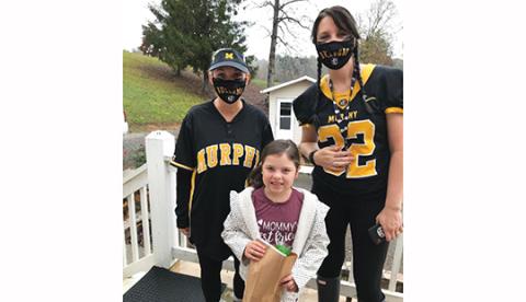Student teacher Dianna Peterson and second-grade teacher Sara Hickey visit remote learner Maci Dockery last week.