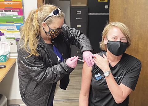 Dr. Mary Lane of the Cherokee County Health Department was one of the first to receive the COVID-19 vaccine in Cherokee County. Nurse Misty Postell is administering the vaccine.