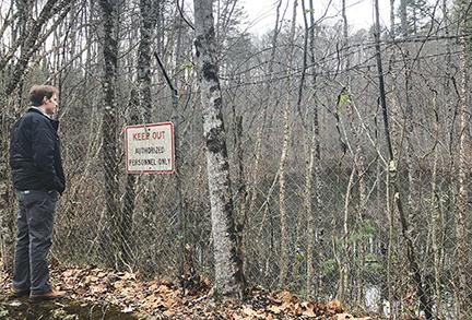 Photos by Penny Ray/pennyray@cherokeescout.com Murphy Town Manager Chad Simons looks out over a reservoir that occupies a portion of 18 acres that’s up for sale.