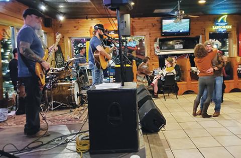 Photos by Samantha Sinclair/scoutingaround@cherokeescout.com The Andrew Chastain Band performs at Chevelles Restaurant & Bar in Murphy.