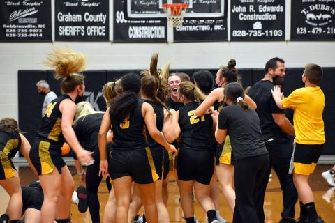 The Murphy Lady Bulldogs celebrate after their Elite Eight victory over Robbinsville.