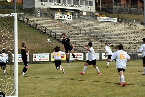 Murphy' Drake Fowler launches himself through the air to attempt a header off of a corner kick. 